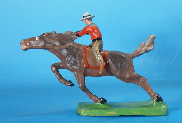 TIPPLE TOPPLE Cowboy mit Gewehr zu Pferd Masse um 1950 WTT023